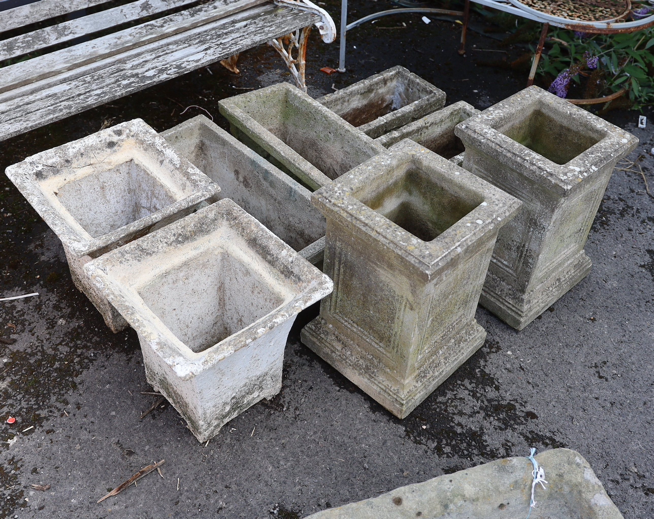 Eight assorted reconstituted stone garden planters, largest height 49cm
